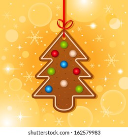 Christmas card with christmas tree cookie hanging with red ribbon