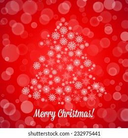 Christmas card with tree made of random snowflakes and bokeh