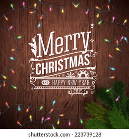 Christmas card with typography design. Wooden background, realistic garland and Christmas tree. Vector illustration.