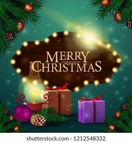 Christmas card with wooden sign, gifts and antique lamp