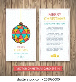 Christmas cards with colored balls with a pattern of triangles, trees and stars. On a wooden background.  Typographic template for your text.