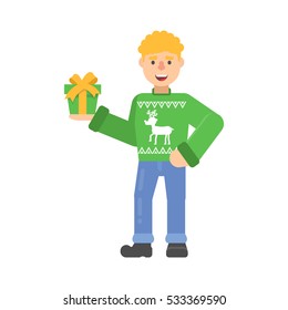 Christmas character young man in green jumper with deer holds a gift in flat cartoon style.