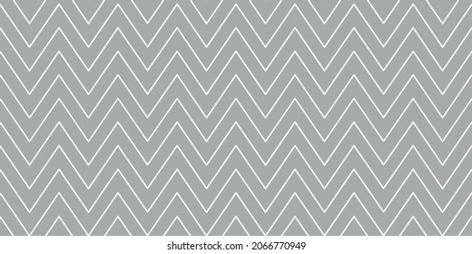 Christmas chevron pattern. Abstract background with white zig-zag stripes on a grey background. Vector illustration