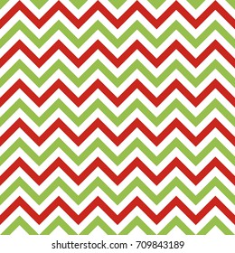 Christmas chevron vector seamless pattern. Zigzag lines background in traditional christmas colors