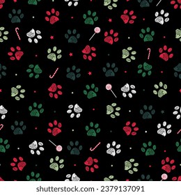 Christmas colored theme with black background paw prints and candies seamless pattern