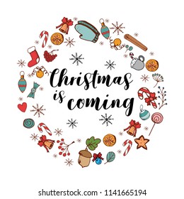 Christmas Is Coming card with festive items. Holiday frame. Greeting card for New Year and Christmas.Christmas hat, acorns, socks, candy canes, snowflakes, mistletoe and ginger cookies.