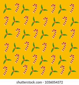 Christmas composition with candies and hawthorn flowers on a yellow background