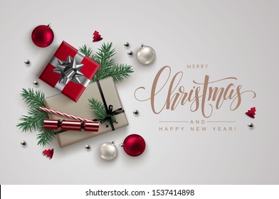 Christmas composition made of gift boxes traditional decoration and pine branches Christmas composition made of gift boxes traditional decoration and pine branches