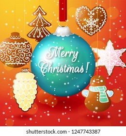 Christmas composition on a red background with a big blue ball and gingerbread on strings. Inscription Merry Christmas