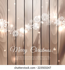 Christmas composition on wood background with snowflakes
