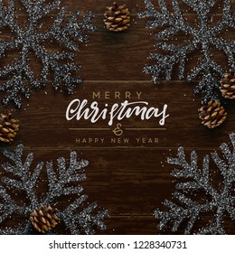 Christmas composition on wooden background. Xmas decoration design, snowflake color black, pine cone. Brown realistic Wood texture. Flat lay, top view. Christmas composition on wooden background. Xmas decoration design, snowflake color black, pine cone. Brown realistic Wood texture. Flat lay, top view.