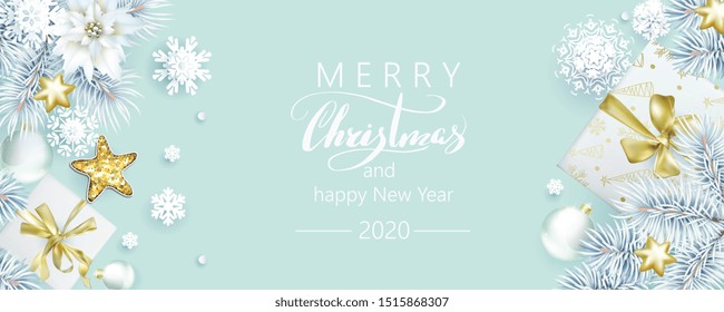 Christmas composition with white spruce branches and gift boxes on bleached coral background, color of 2020