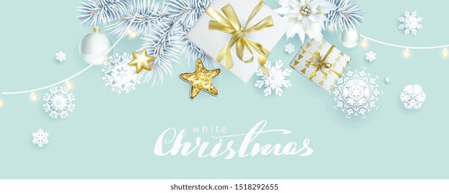 Christmas composition with white spruce branches and gift boxes on bleached coral background, color of 2020