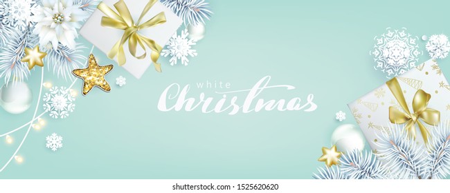 Christmas composition with white spruce branches and gift boxes on bleached coral background, color of 2020