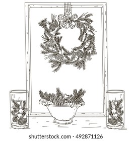 Christmas composition. Wreath decorated with pine cones and berries on a frame. Candlesticks.