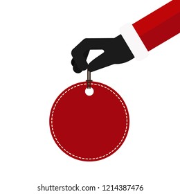 Christmas concept. Santa claus hand hold red price tag