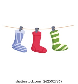 Christmas concept with three colorful socks hanging on a clothesline