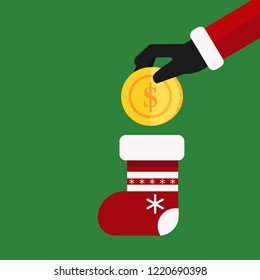 Christmas concept,Santa Claus hand holding a golden bitcoin dropping it into Christmas stocking