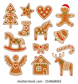 Christmas cookies collection with gingerbread and cookies figures isolated on white background - xmas tree, candy cane, angel, bell, sock, gingerbread men, star, heart, deer, rocking horse.