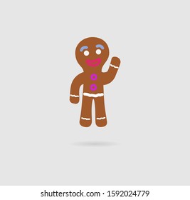 Christmas cookies in the form of a man of brown color on a gray background.