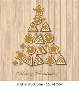 Christmas cookies tree on wood background