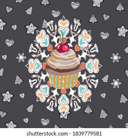 quequito de Navidad con cereza sobre el fondo marrón con patrones de cocina.