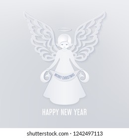 Christmas cute angel with scroll in the hands with Merry Christmas text on a light background. Ornamental wings in paper cut style. Happy new year card in the style of layered paper.