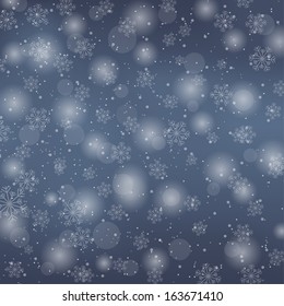 Christmas dark blue background with falling snowflakes