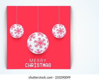 Christmas Day celebration with hanging Xmas balls decorated with snowflake and stylish text on red background.