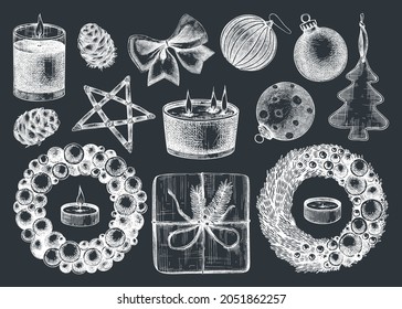 Christmas decoration elements collection. Winter holidays drawings on chalkboard. Hand-sketched Christmas tree decorations, balls, cones, candles. Perfect for greeting cards, invitations, ads banners.