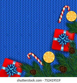 Christmas decoration with fir tree, gift, candy canes on blue knitted background. Vector illustration 