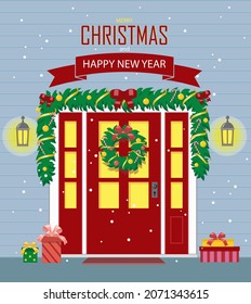 Christmas decoration of the front door. The external entrance to the house, decorated with New Year's garlands and a wreath. Christmas greeting card