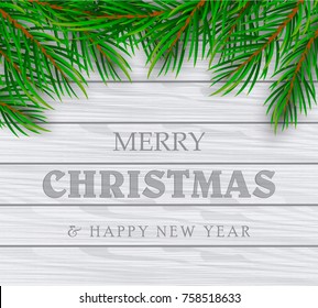 Christmas Decoration. Green branches of a Christmas tree on a background of wood. Vector Eps10