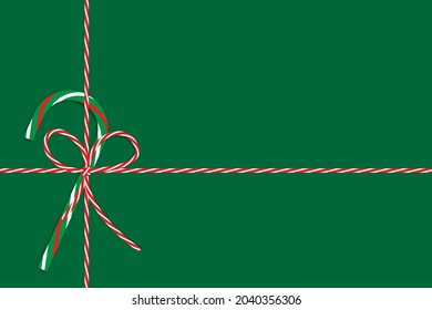 Christmas decoration with green candy cane, red and yellow bow, ribbon. Holiday gift. Vector illustration. Stock image. 