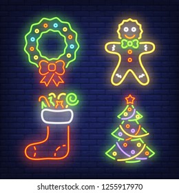 Christmas decoration neon sign set. Wreath, gingerbread, tree, stocking on brick wall background. Vector illustration in neon style for topics like Xmas party, decor, ornament