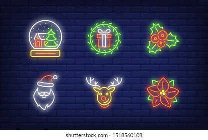 Christmas decoration neon sign set. Reindeer, Santa Claus, poinsettia, snow globe. Vector illustration in neon style, bright banner for topics like Xmas, December holidays, vacation