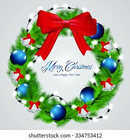Christmas decoration ornaments and lights on a wreath.