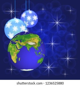 christmas decorations as globe on background of blue bokeh