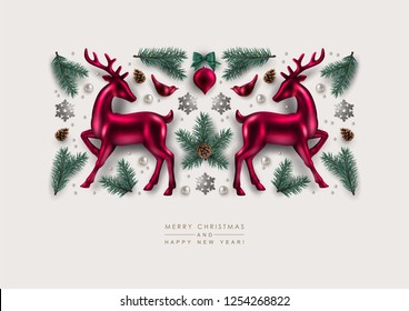 Christmas Decorative Composition made of Pine Branches, Ornaments, Glitter Snowflakes,  and  Glass Deer. Flat lay, top view.