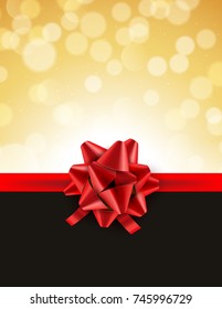 Christmas defocused bokeh background with red bow. Gift card holiday celebration invitation xmas.