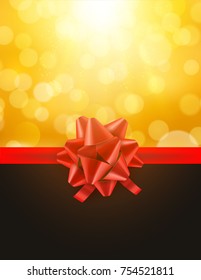 Christmas defocused bokeh background with red bow. Gift card holiday celebration invitation xmas.
