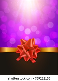 Christmas defocused bokeh background with red bow. Gift card holiday celebration invitation xmas.