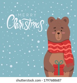 Christmas design. A cute bear in a scarf with a gift stands under the snow. Vector illustration. Lettering with congratulations.