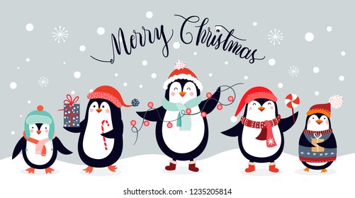 Christmas design with cute penguins on an winter landscape