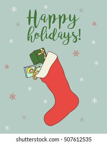 Christmas Design For A Seasonal Greeting Card. Hand Drawn Vector Illustration On A Green Pastel Background And Isolated Objects Such As Christmas Stocking, Text And Snowflakes.  