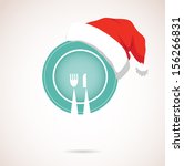 christmas dinner. plate wearing christmas red hat