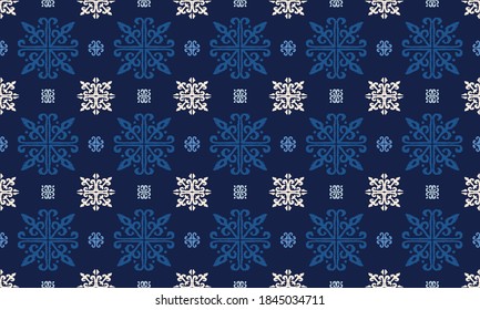 Christmas drawing with snowflakes. The Nordic style. Folk print with flakes. Scandinavian, Portuguese ornament. Spanish porcelain. Oriental damask. Ethnic motif. Ikat geometric folklore background. 