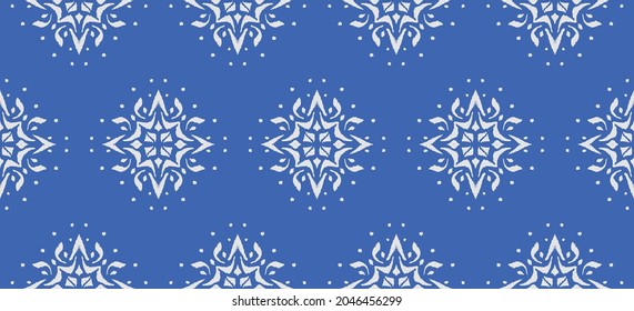 Christmas drawing with snowflakes. The Nordic style. Folk print with flakes. Scandinavian, Portuguese ornament. Spanish porcelain. Oriental damask. Ethnic motif. Ikat geometric folklore background. 