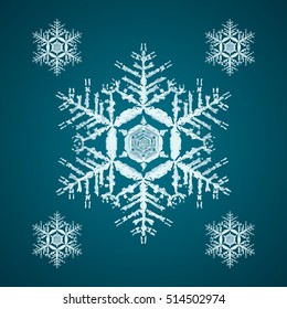 Christmas element: opaque crystal snowflakes on a dark turquoise background.