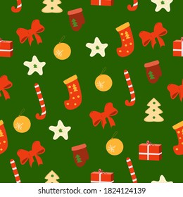 Christmas elements seamless pattern on green background